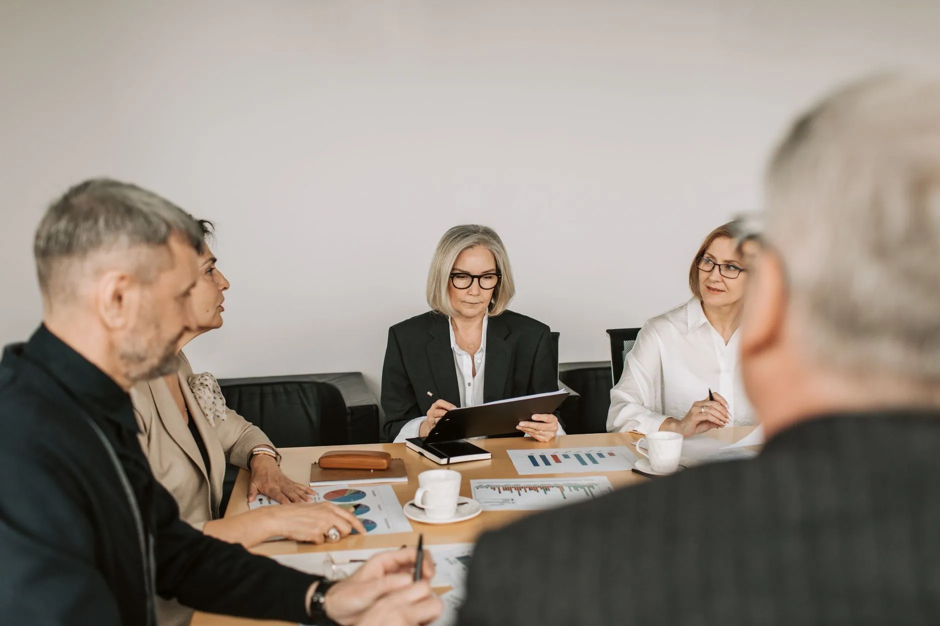 A leadership team meeting around a table